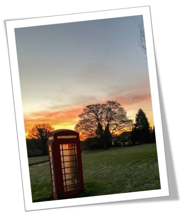 Sunset over the village phonebox